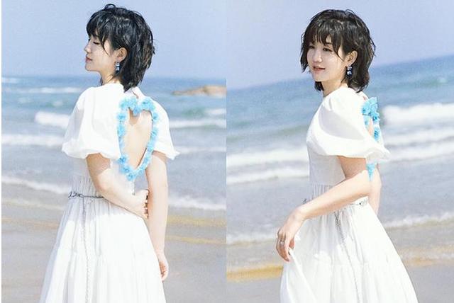 国乒一姐陈梦晒美照，海边身穿白裙气质优雅，被网友认为“飘了”(1)